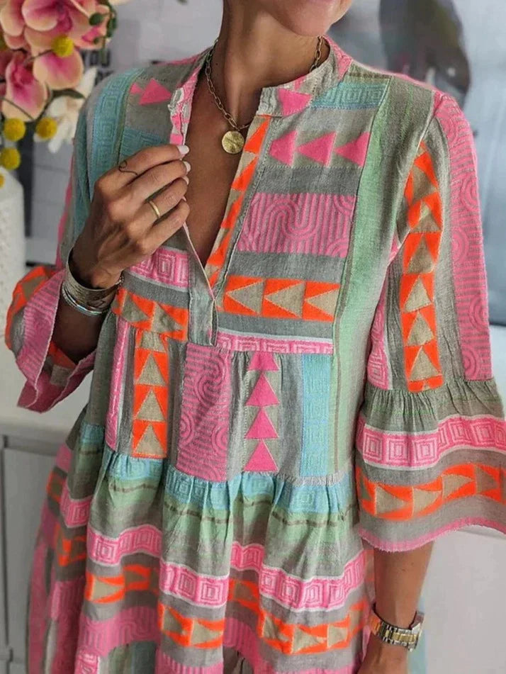 Yasmine - Striking Midi Dress with Deep V-neck and Colorful Pattern